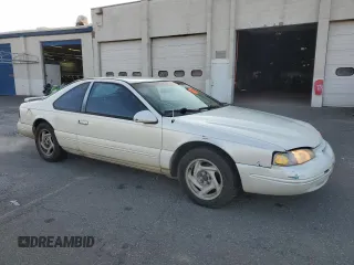 1996 Ford Thunderbird LX with VIN 1FALP62W0TH162431, listed as a Copart auction lot 41864445 with 183,798 mi miles and Salvage Title. Bid and sale history available at DreamBid. Image 4.