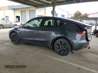 2025 Tesla Model Y Long Range with VIN 7SAYGDED2SF234388, listed as a Copart auction lot 47250965 with 3,702 mi miles and Salvage Title. Bid and sale history available at DreamBid. Image 2.