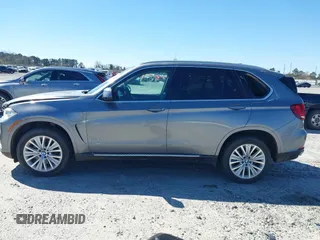 2016 BMW X5 xDrive40e z VIN 5UXKT0C50G0F75010, wystawiony jako IAAI lot #41732410 z przebiegiem 88 671 mil mil oraz . Historia ofert i sprzedaży dostępna na DreamBid. Obrazek 14.