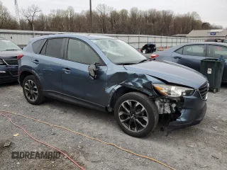 2016 Mazda CX-5 Grand Touring with VIN JM3KE4DY7G0761594, listed as a Copart auction lot 51514595 with 58,250 mi miles and Salvage Title. Bid and sale history available at DreamBid. Image 4.