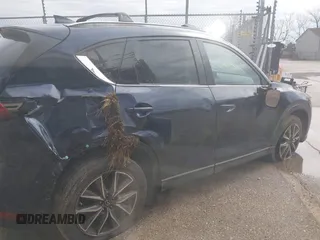 2018 Mazda CX-5 Grand Touring with VIN JM3KFADM1J1439544, listed as a IAAI auction lot 41891134 with 54,132 mi miles and . Bid and sale history available at DreamBid. Image 4.