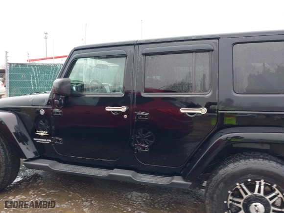 2011 Jeep Wrangler Unlimited Sahara with VIN 1J4BA5H12BL548870, listed as a IAAI auction lot 42010303 with 139,693 mi miles. Bid and sale history available at carsss.com. Image 14.