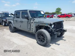 2022 Jeep Gladiator Altitude z VIN 1C6HJTAG2NL120294, wystawiony jako IAAI lot #42356670 z przebiegiem 29 883 mil mil oraz . Historia ofert i sprzedaży dostępna na DreamBid. Obrazek 1.