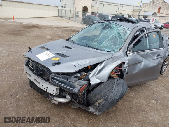 2014 Mitsubishi Lancer Evolution MR with VIN JA32W5FV7EU008165, listed as a IAAI auction lot 41553978 with 49,284 mi miles. Bid and sale history available at carsss.com. Image 6.