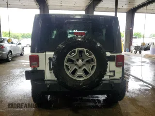2013 Jeep Wrangler Rubicon 10th Anniversary z VIN 1C4BJWCGXDL543958, wystawiony jako Copart lot #58492255 z przebiegiem 94 455 mil mil oraz Szkoda całkowita • Salvage title. Historia ofert i sprzedaży dostępna na DreamBid. Obrazek 6.