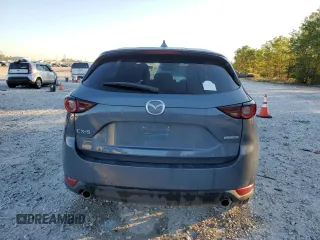2021 Mazda CX-5 Touring with VIN JM3KFACM3M0387734, listed as a Copart auction lot 79894294 with 65,819 mi miles and Clean Title. Bid and sale history available at carsss.com. Image 6.