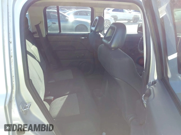 2009 Jeep Patriot Sport with VIN 1J4FT28B99D121838, listed as a IAAI auction lot 42000092 with 218,483 mi miles. Bid and sale history available at carsss.com. Image 8.