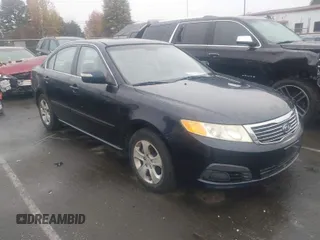 2009 Kia Optima LX with VIN KNAGE228095303047, listed as a IAAI auction lot 41128475 with 165,317 mi miles. Bid and sale history available at carsss.com. Image 1.