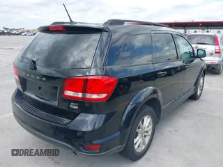 2015 Dodge Journey SXT with VIN 3C4PDCBG5FT604847, listed as a IAAI auction lot 42108853 with 164,679 mi miles. Bid and sale history available at carsss.com. Image 4.
