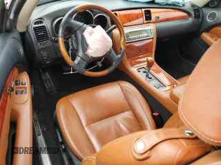 2002 Lexus SC 430 with VIN JTHFN48Y920006524, listed as a Copart auction lot 64680695 with 166,118 mi miles and Salvage title. Bid and sale history available at DreamBid. Image 8.