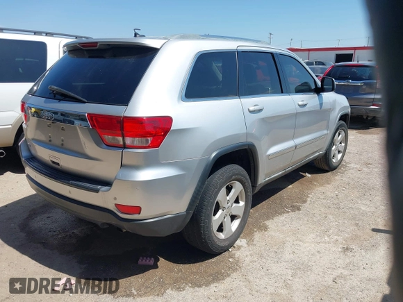 2012 Jeep Grand Cherokee Laredo with VIN 1C4RJEAG4CC167557, listed as a IAAI auction lot 42047720 with 195,631 mi miles. Bid and sale history available at carsss.com. Image 4.