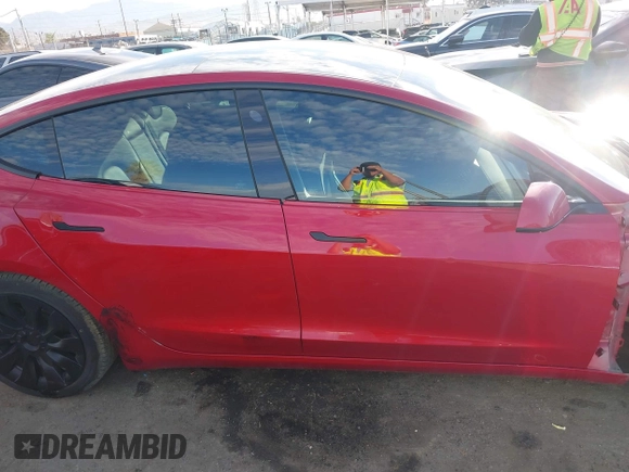 2022 Tesla Model 3 with VIN 5YJ3E1EA1NF288903, listed as a IAAI auction lot 41610215 with 96,050 mi miles and . Bid and sale history available at DreamBid. Image 13.