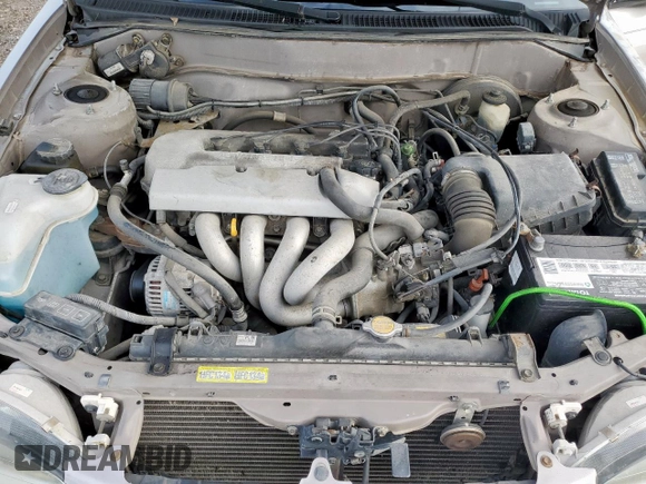 1999 Toyota Corolla VE z VIN 1NXBR12E0XZ215258, wystawiony jako Copart lot #60704095 z przebiegiem Nie podano mil oraz Szkoda całkowita • Salvage title. Historia ofert i sprzedaży dostępna na DreamBid. Obrazek 11.