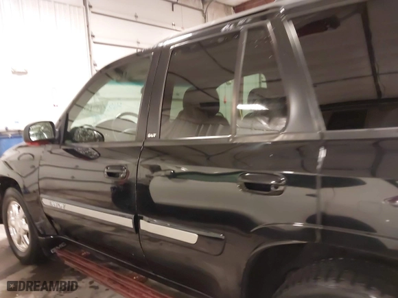 2004 GMC Envoy SLE with VIN 1GKDT13S542265104, listed as a IAAI auction lot 41884797 with 154,190 mi miles. Bid and sale history available at carsss.com. Image 15.