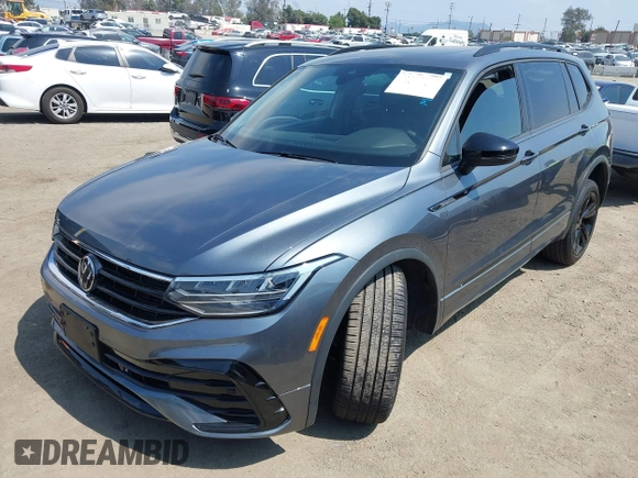 2023 Volkswagen Tiguan SE R-Line Black with VIN 3VVCB7AX8PM036684, listed as a IAAI auction lot 42169004 with 25,024 mi miles and . Bid and sale history available at DreamBid. Image 16.