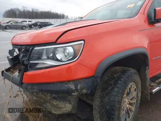 2019 Chevrolet Colorado 4WD ZR2 z VIN 1GCGTEEN1K1160280, wystawiony jako IAAI lot #41166240 z przebiegiem 71 529 mil mil oraz . Historia ofert i sprzedaży dostępna na DreamBid. Obrazek 14.