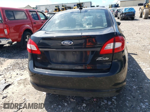 2012 Ford Fiesta SE z VIN 3FADP4BJ5CM195837, wystawiony jako Copart lot #57363165 z przebiegiem 108 003 mil mil oraz Szkoda całkowita • Salvage title. Historia ofert i sprzedaży dostępna na DreamBid. Obrazek 6.