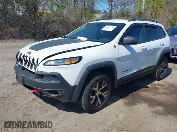 2014 Jeep Cherokee Trailhawk with VIN 1C4PJMBS8EW163212, listed as a IAAI auction lot 42124107 with 114,999 mi miles. Bid and sale history available at carsss.com. Image 17.