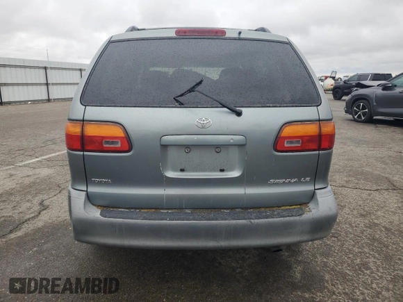 2000 Toyota Sienna LE with VIN 4T3ZF13C2YU217185, listed as a Copart auction lot 82407944 with 244,381 mi miles and Salvage Title. Bid and sale history available at DreamBid. Image 6.