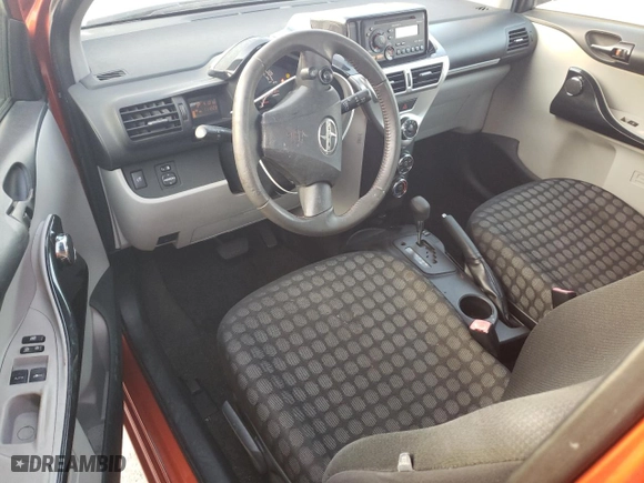 2012 Scion iQ with VIN JTNJJXB00CJ012327, listed as a Copart auction lot 87223244 with 111,223 mi miles and Salvage Title. Bid and sale history available at carsss.com. Image 8.