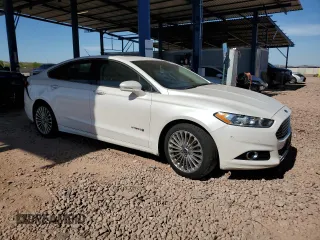 2013 Ford Fusion Titanium Hybrid z VIN 3FA6P0RUXDR376633, wystawiony jako Copart lot #57685555 z przebiegiem 133 248 mil mil oraz Szkoda całkowita • Salvage title. Historia ofert i sprzedaży dostępna na DreamBid. Obrazek 4.