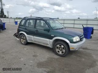 1999 Suzuki Grand Vitara LX with VIN JS3TD62V0X4124366, listed as a Copart auction lot 50885055 with 204,168 mi miles and Salvage Title. Bid and sale history available at carsss.com. Image 4.