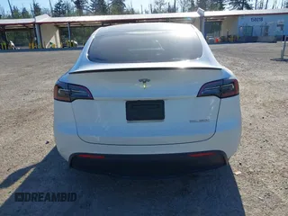2023 Tesla Model Y Performance with VIN 7SAYGDEF2PF754938, listed as a IAAI auction lot 42067041 with 21,103 mi miles and . Bid and sale history available at DreamBid. Image 16.