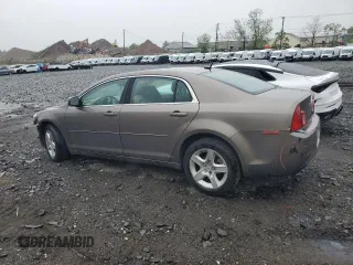 2011 Chevrolet Malibu 1LS with VIN 1G1ZB5E10BF200563, listed as a Copart auction lot 56359625 with 130,820 mi miles and Salvage Title. Bid and sale history available at DreamBid. Image 2.
