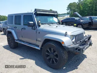 2013 Jeep Wrangler Unlimited Sahara with VIN 1C4BJWEG4DL666930, listed as a IAAI auction lot 42310569 with 206,577 mi miles and . Bid and sale history available at DreamBid. Image 1.