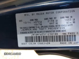 2015 Mazda 3 S Grand Touring z VIN JM1BM1W35F1238188, wystawiony jako IAAI lot #41206030 z przebiegiem 316 542 mil mil oraz . Historia ofert i sprzedaży dostępna na DreamBid. Obrazek 9.