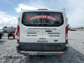 2017 Ford Transit Cargo with VIN 1FTYR2ZM2HKA00916, listed as a Copart auction lot 63469325 with 185,274 mi miles and Clean title. Bid and sale history available at DreamBid. Image 6.