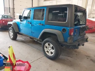 2015 Jeep Wrangler Unlimited Rubicon with VIN 1C4BJWFG7FL661643, listed as a IAAI auction lot 41291385 with 112,785 mi miles. Bid and sale history available at carsss.com. Image 3.