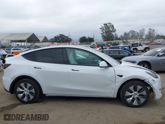 2024 Tesla Model Y with VIN 7SAYGDED4RF055859, listed as a IAAI auction lot 42201099 with 17,373 mi miles and . Bid and sale history available at DreamBid. Image 13.