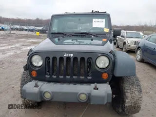 2008 Jeep Wrangler Unlimited X with VIN 1J4GA39138L641138, listed as a IAAI auction lot 41986230 with 215,026 mi miles. Bid and sale history available at carsss.com. Image 13.