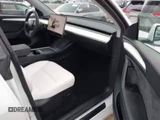2024 Tesla Model Y with VIN 7SAYGDED4RF055859, listed as a IAAI auction lot 42201099 with 17,373 mi miles and . Bid and sale history available at DreamBid. Image 5.