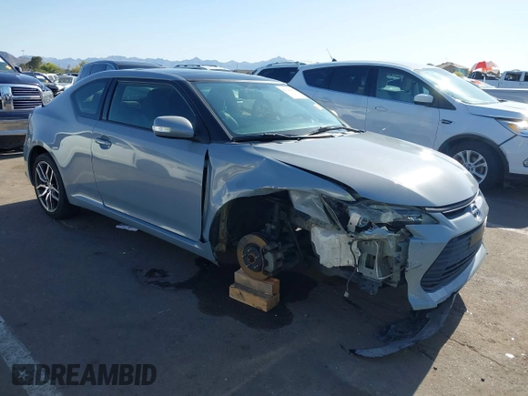 2015 Scion tC with VIN JTKJF5C7XFJ012872, listed as a IAAI auction lot 42128621 with 100,832 mi miles. Bid and sale history available at carsss.com. Image 1.
