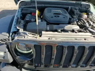 2023 Jeep Wrangler Sport S с VIN 1C4HJXDN7PW509945, выставлен на аукционе Copart как лот 66694605 с пробегом 22 731 миль миль и Списание • Salvage title. История ставок и продаж доступна на DreamBid. Изображение 13.