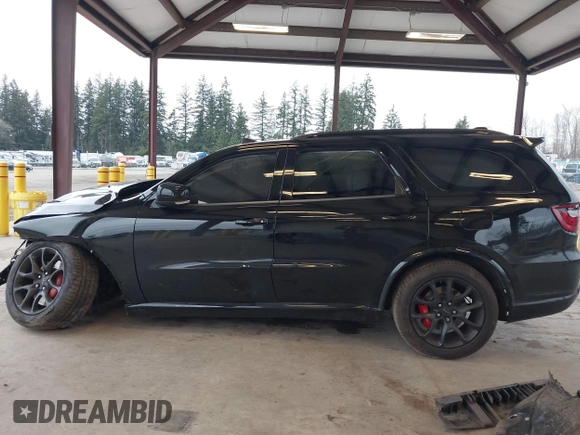 2023 Dodge Durango SRT 392 Premium with VIN 1C4SDJGJ6PC592871, listed as a IAAI auction lot 41740993 with 9,028 mi miles and . Bid and sale history available at DreamBid. Image 14.