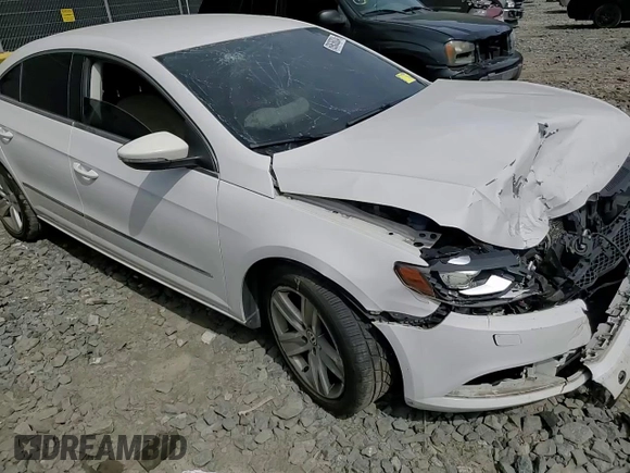 2014 Volkswagen CC Sport with VIN WVWBN7AN3EE528302, listed as a Copart auction lot 69636034 with 77,332 mi miles and Salvage Title. Bid and sale history available at DreamBid. Image 10.