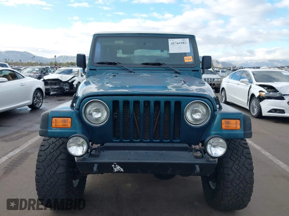 1998 Jeep Wrangler Sport with VIN 1J4FY19S7WP787679, listed as a IAAI auction lot 41764883 with 134,144 mi miles. Bid and sale history available at carsss.com. Image 12.