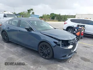 2024 Mazda 3 S Carbon Edition with VIN 3MZBPBCM1RM411199, listed as a IAAI auction lot 41673561 with 26,233 mi miles and . Bid and sale history available at DreamBid. Image 1.