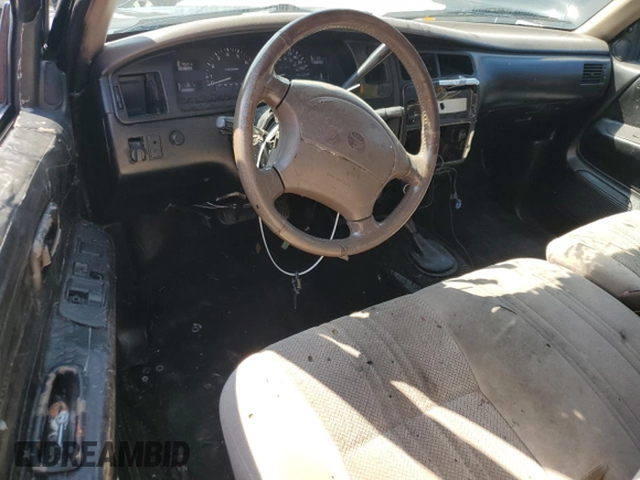 1997 Toyota T100 SR5 with VIN JT4UN24D9V0050303, listed as a Copart auction lot 68910134 with 281,477 mi miles and Salvage Title. Bid and sale history available at DreamBid. Image 8.