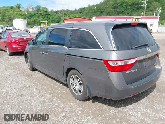 2012 Honda Odyssey EX-L with VIN 5FNRL5H68CB060487, listed as a IAAI auction lot 42176223 with 234,078 mi miles and . Bid and sale history available at DreamBid. Image 3.