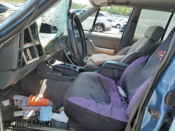 1991 Jeep Cherokee z VIN 1J4FJ58S0ML519252, wystawiony jako Copart lot #55458005 z przebiegiem 152 129 mil mil oraz Szkoda całkowita • Salvage title. Historia ofert i sprzedaży dostępna na DreamBid. Obrazek 7.