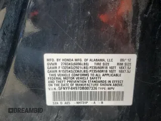 2013 Honda Pilot Touring z VIN 5FNYF4H97DB007336, wystawiony jako Copart lot #52785595 z przebiegiem 141 104 mil mil oraz Szkoda całkowita • Salvage title. Historia ofert i sprzedaży dostępna na DreamBid. Obrazek 13.