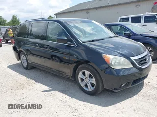 2008 Honda Odyssey Touring with VIN 5FNRL38918B095670, listed as a IAAI auction lot 42662909 with 162,654 mi miles and . Bid and sale history available at DreamBid. Image 1.