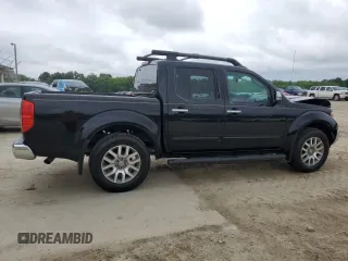 2011 Nissan Frontier Pro-4X with VIN 1N6AD0EVXBC433028, listed as a Copart auction lot 57653305 with 144,753 mi miles and Salvage title. Bid and sale history available at DreamBid. Image 3.
