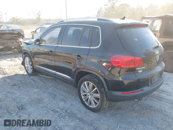 2012 Volkswagen Tiguan SE with VIN WVGAV7AX8CW565863, listed as a IAAI auction lot 41528643 with 122,569 mi miles and . Bid and sale history available at DreamBid. Image 3.