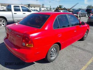 2003 Hyundai Accent GL with VIN KMHCG45C93U487209, listed as a IAAI auction lot 41590636 with 118,811 mi miles. Bid and sale history available at carsss.com. Image 4.