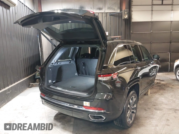 2023 Jeep Grand Cherokee Overland with VIN 1C4RJHDG0P8701157, listed as a IAAI auction lot 42080201 with 24,709 mi miles and . Bid and sale history available at DreamBid. Image 4.